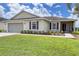 Single story home with attached two-car garage and well-manicured lawn at 7407 64Th E St, Palmetto, FL 34221