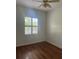 Bright bedroom with hardwood floors, ceiling fan, and window at 10228 Silverado Cir, Lakewood Ranch, FL 34202