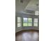 Bright dining room with hardwood floors and multiple windows at 10228 Silverado Cir, Lakewood Ranch, FL 34202