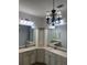 Double vanity bathroom with lots of storage and a chandelier at 10228 Silverado Cir, Lakewood Ranch, FL 34202
