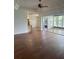Spacious living room with hardwood floors, access to sunroom, and high ceilings at 10228 Silverado Cir, Lakewood Ranch, FL 34202
