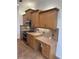 Kitchen with built-in desk, stainless steel appliances, and substantial cabinet space at 10228 Silverado Cir, Lakewood Ranch, FL 34202