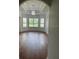 Spacious dining room with hardwood floors and a large window at 10228 Silverado Cir, Lakewood Ranch, FL 34202