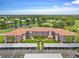 Condo building with parking and landscaping at 6505 Stone River Rd # 101, Bradenton, FL 34203