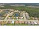 Aerial view of a residential community with houses and a lake at 13212 Deep Blue Pl, Lakewood Ranch, FL 34211