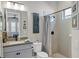 Clean bathroom with shower/tub combo and gray tile at 13212 Deep Blue Pl, Lakewood Ranch, FL 34211