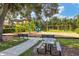 Community playground with play structures, picnic tables, and a walking path at 13212 Deep Blue Pl, Lakewood Ranch, FL 34211