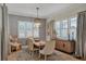 Charming dining area with wood table, neutral tones, and natural light at 13212 Deep Blue Pl, Lakewood Ranch, FL 34211