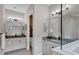 Elegant bathroom with double vanity and a soaking tub at 13212 Deep Blue Pl, Lakewood Ranch, FL 34211