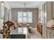 Bright dining room with shiplap accent wall and farmhouse table at 13212 Deep Blue Pl, Lakewood Ranch, FL 34211