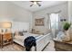 Cozy bedroom with a queen bed and window seating at 13212 Deep Blue Pl, Lakewood Ranch, FL 34211