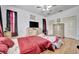Main bedroom with wood floors, a large bed and plenty of dresser space at 6122 44Th E Ct, Bradenton, FL 34203