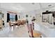Spacious dining area with a wood table and chairs, view of kitchen, and decorative accents at 6122 44Th E Ct, Bradenton, FL 34203