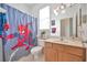 Bathroom with shower/tub combo and Spiderman theme at 6122 44Th E Ct, Bradenton, FL 34203