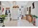 Bright and spacious entryway with decorative accents and tile flooring at 6122 44Th E Ct, Bradenton, FL 34203