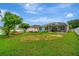 Large backyard with grassy area, perfect for outdoor activities at 6122 44Th E Ct, Bradenton, FL 34203