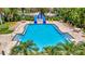Community pool area with lounge chairs and a waterslide at 6122 44Th E Ct, Bradenton, FL 34203