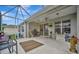 Spacious screened patio with ceiling fan, great for relaxing and entertaining at 6122 44Th E Ct, Bradenton, FL 34203