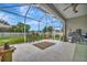 This screened patio provides shaded outdoor living space at 6122 44Th E Ct, Bradenton, FL 34203