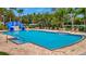 Community pool with waterslide and plenty of lounge chairs at 6122 44Th E Ct, Bradenton, FL 34203