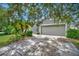 One-story home with a two-car garage and mature landscaping at 6122 44Th E Ct, Bradenton, FL 34203
