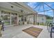 Relaxing screened patio with a ceiling fan and access to the backyard at 6122 44Th E Ct, Bradenton, FL 34203