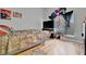 Bedroom with full-size bed and wood flooring at 6122 44Th E Ct, Bradenton, FL 34203