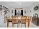 Bright dining room with a large wooden table and six chairs at 6122 44Th E Ct, Bradenton, FL 34203