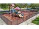 Community playground with playset, swings, and safety surface at 6122 44Th E Ct, Bradenton, FL 34203