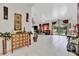 Open concept living room and hallway with tile floors and decorative accents at 6122 44Th E Ct, Bradenton, FL 34203