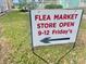 Sign indicating the days and hours for a flea market at 1806 Brook Field Ter, Sarasota, FL 34234
