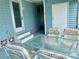 Covered patio with table and chairs, adjacent to the house at 1806 Brook Field Ter, Sarasota, FL 34234