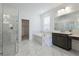 Spa-like bathroom with marble finishes and a walk-in shower at 9478 Tequila Sunrise Dr, Sarasota, FL 34241
