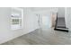 Bright entryway with stairs and wood-look flooring at 9478 Tequila Sunrise Dr, Sarasota, FL 34241