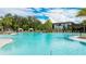 Inviting community pool with plenty of lounge chairs at 9478 Tequila Sunrise Dr, Sarasota, FL 34241