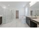 Elegant bathroom with marble floors, shower, and soaking tub at 9478 Tequila Sunrise Dr, Sarasota, FL 34241