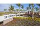 Skye Ranch community entrance with palm trees and signage at 9478 Tequila Sunrise Dr, Sarasota, FL 34241