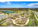 Community playground with play structures and walking paths at 9478 Tequila Sunrise Dr, Sarasota, FL 34241