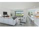 Open living space with water view, and modern furniture at 9478 Tequila Sunrise Dr, Sarasota, FL 34241