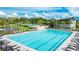 Community lap pool with plenty of lounge chairs at 9478 Tequila Sunrise Dr, Sarasota, FL 34241
