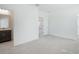 Bright bedroom with ensuite bathroom access and neutral decor at 9478 Tequila Sunrise Dr, Sarasota, FL 34241