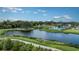 Resort-style pool and lake in a lush community setting at 9478 Tequila Sunrise Dr, Sarasota, FL 34241