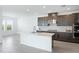 Modern kitchen with stainless steel appliances and a large island at 9478 Tequila Sunrise Dr, Sarasota, FL 34241