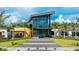 Modern community clubhouse with glass facade and landscaping at 9478 Tequila Sunrise Dr, Sarasota, FL 34241