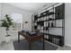 Home office with built-in shelving and workspace at 9478 Tequila Sunrise Dr, Sarasota, FL 34241