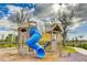 Fun playground with a large wooden play structure and slide at 9478 Tequila Sunrise Dr, Sarasota, FL 34241