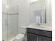 Clean bathroom with glass shower, toilet and dark brown vanity at 9478 Tequila Sunrise Dr, Sarasota, FL 34241