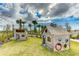Charming play area with two wooden playhouses at 9478 Tequila Sunrise Dr, Sarasota, FL 34241