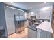 Modern kitchen with stainless steel appliances and ample cabinet space at 7823 33Rd E St # 20, Sarasota, FL 34243