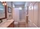 Guest bathroom with tub shower combo and wood vanity at 7823 33Rd E St # 20, Sarasota, FL 34243